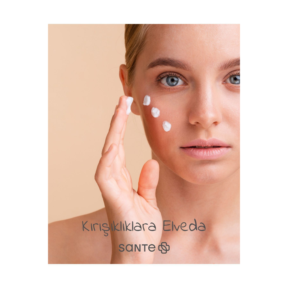 Model applying Sante Botolifting Anti-Wrinkle cream on her face, promoting youthful and smooth skin.